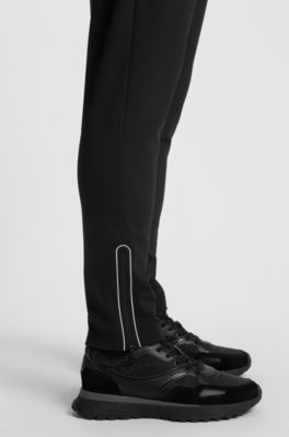 Active stretch-gabardine tracksuit bottoms with thermoregulating technology, Black