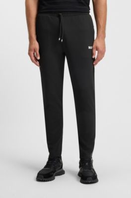 Active stretch-gabardine tracksuit bottoms with thermoregulating technology, Black