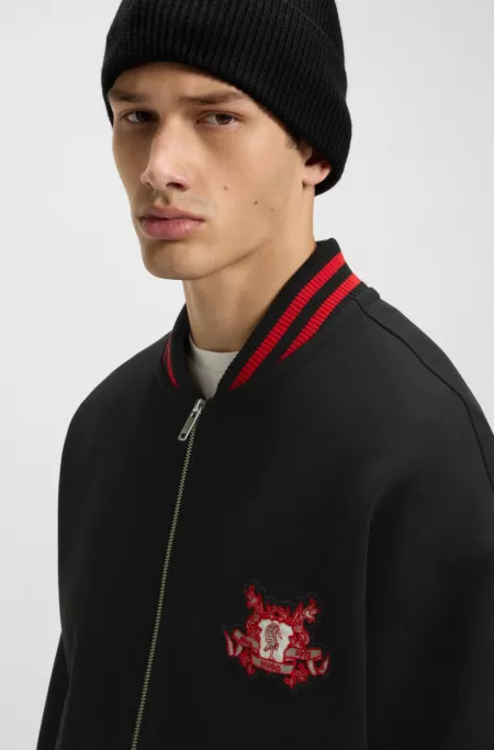 Oversized-fit cotton bomber jacket with collegiate logo embroidery