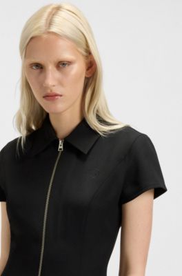 Robe pr&egrave;s du corps zipp&eacute;e sur le devant avec jupe pliss&eacute;e, Noir