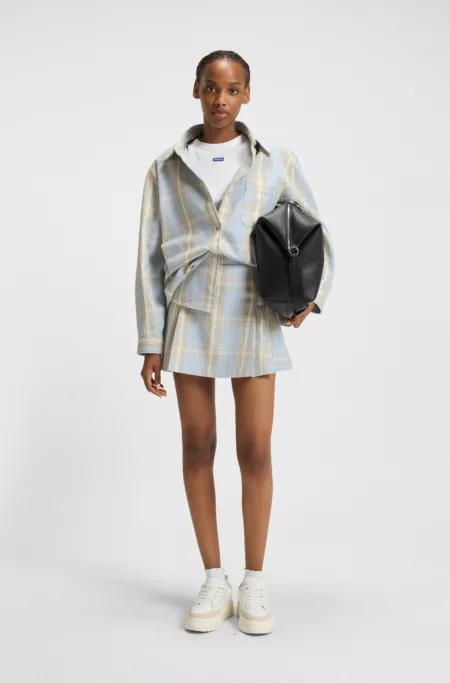 Pleated mini skirt in checked cotton twill