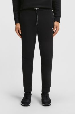 Cotton-blend tracksuit bottoms with striped trims, Black