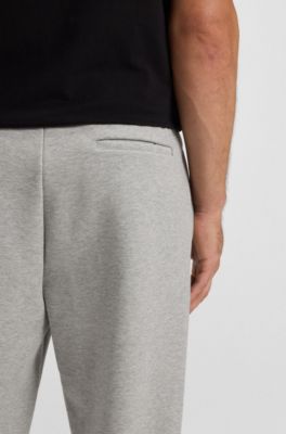 Pantalones de ch&aacute;ndal de algod&oacute;n con detalles de rayas, Gris