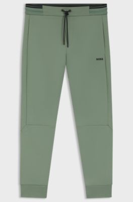 Cotton-blend tracksuit bottoms with striped trims, Green