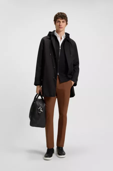 Water-repellent coat with concealed closure
