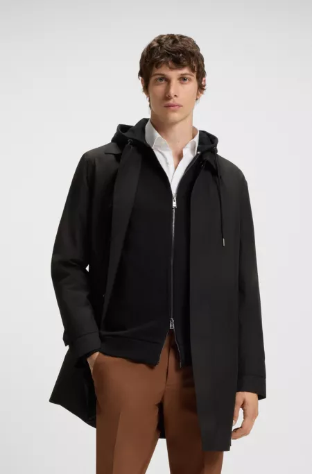 Water-repellent coat with concealed closure
