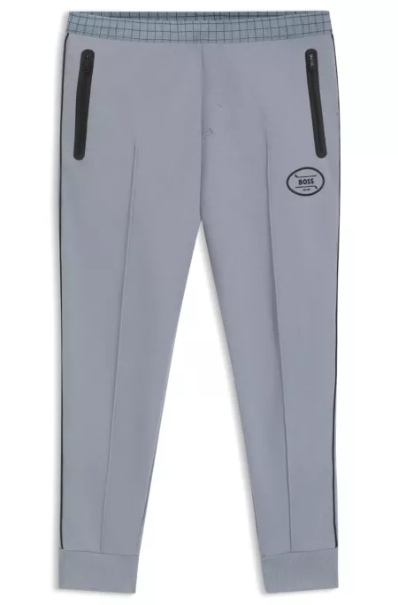 Check-print tracksuit bottoms in stretch piqué