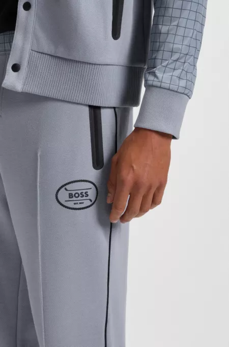 Check-print tracksuit bottoms in stretch piqué