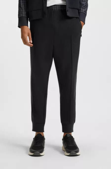 Check-print tracksuit bottoms in stretch piqué