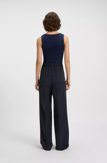 Formal trousers with pleat details