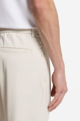 Packable slim-fit trousers in performance-stretch fabric, Natural