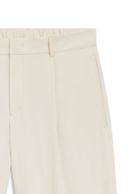 Relaxed-fit trousers in water-repellent stretch fabric, White