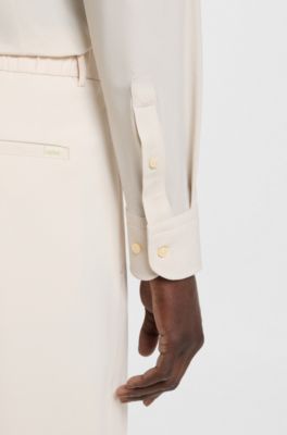 Relaxed-fit trousers in water-repellent stretch fabric, White