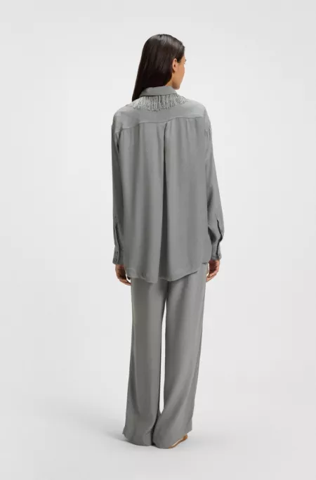 Oversized-fit blouse with logos and fringing