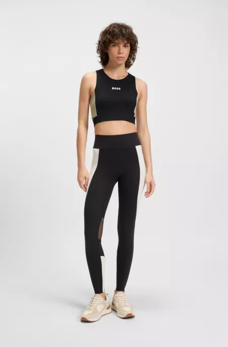 Active top in stretch interlock with cutout details