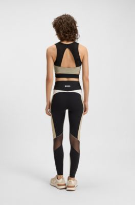 Haut Actif en tissu interlock stretch avec d&eacute;coupes, Noir
