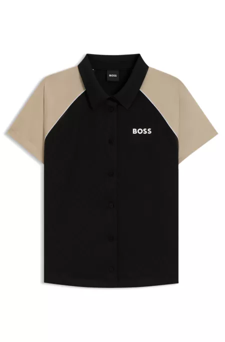 Top activo con botones y monograma en tejido jacquard