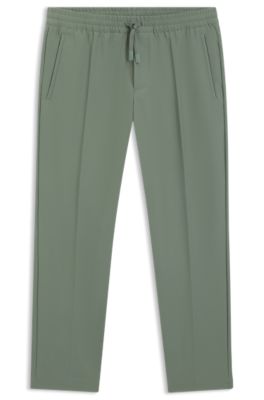 Vandskyende bukser i let, strygelet stof, Lysegr&oslash;n