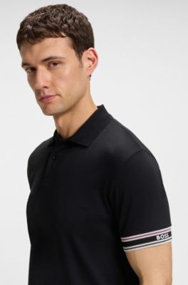 Slim-Fit Poloshirt aus Baumwolle mit gestreiften &Auml;rmelb&uuml;ndchen, Schwarz
