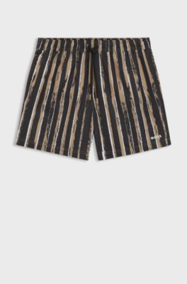 Quick-dry swim shorts with all-over print, Black / Beige