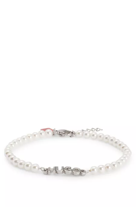 Pearl cuff with hardware logo plaque