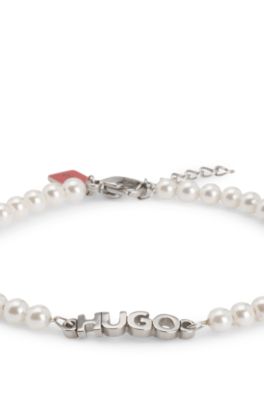 Pearl cuff with hardware logo plaque, White