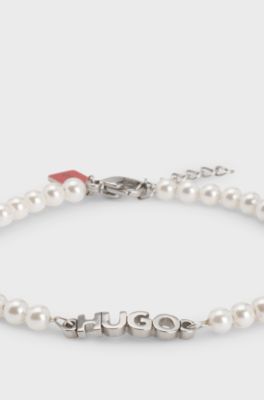 Pearl cuff with hardware logo plaque, White