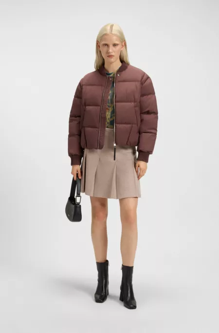 Jupe courte plissée en tissu stretch mouliné