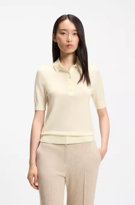 Short-sleeved sweater in merino wool with polo collar