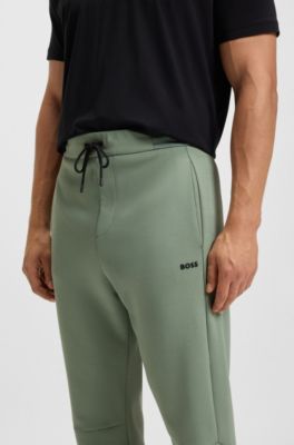Cotton-blend tracksuit bottoms with striped waistband, Green