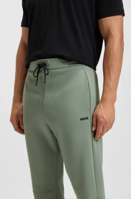 Bas de survêtement en coton mélangé avec taille à rayures