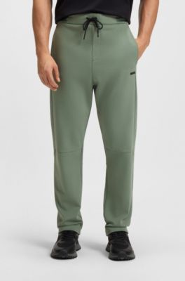 Cotton-blend tracksuit bottoms with striped waistband, Green