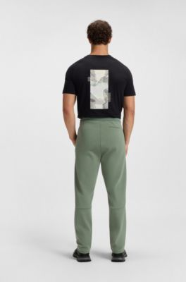 Cotton-blend tracksuit bottoms with striped waistband, Green