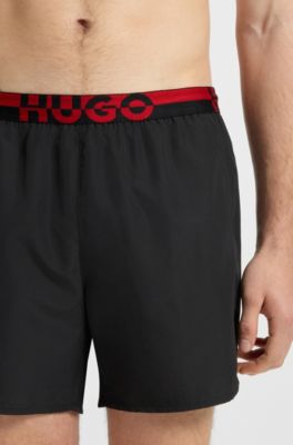 Boxer da mare con elastico in vita con logo spezzato, Nero
