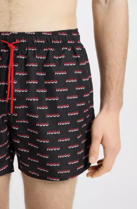 Swim shorts with all-over split-logo print