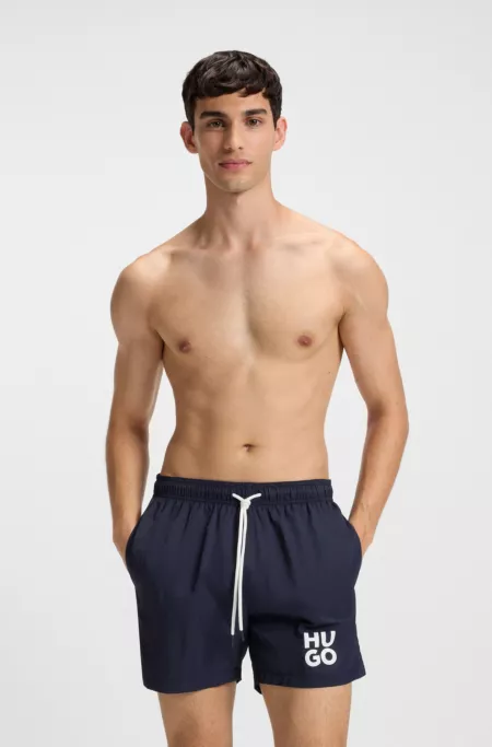 Swim shorts with stacked-logo print