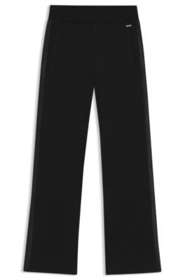 Tracksuit bottoms in piqu&eacute; jersey with monogram tape, Black