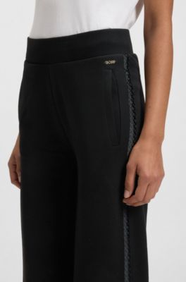 Tracksuit bottoms in piqu&eacute; jersey with monogram tape, Black