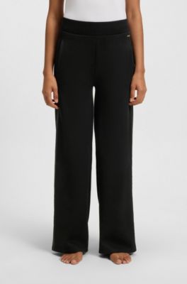 Tracksuit bottoms in piqu&eacute; jersey with monogram tape, Black