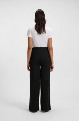 Tracksuit bottoms in piqu&eacute; jersey with monogram tape, Black