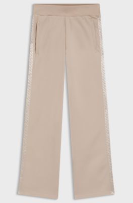 Tracksuit bottoms in piqu&eacute; jersey with monogram tape, Light Beige