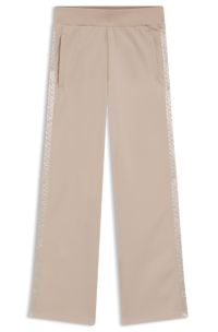 Tracksuit bottoms in piqué jersey with monogram tape, Light Beige