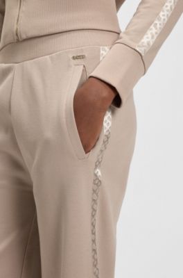 Tracksuit bottoms in piqu&eacute; jersey with monogram tape, Light Beige