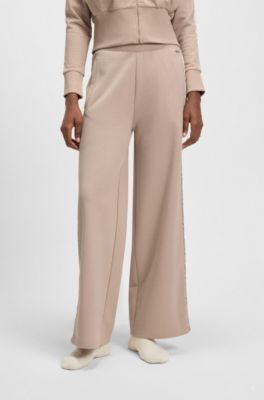 Tracksuit bottoms in piqu&eacute; jersey with monogram tape, Light Beige