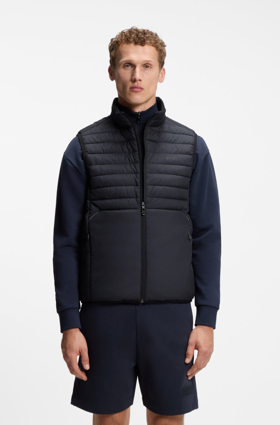 Water-repellent gilet with decorative reflective accents