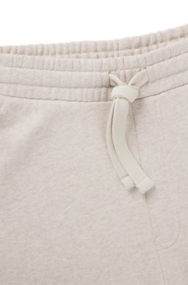 Cotton-terry tracksuit bottoms with embroidered graphics, Natural