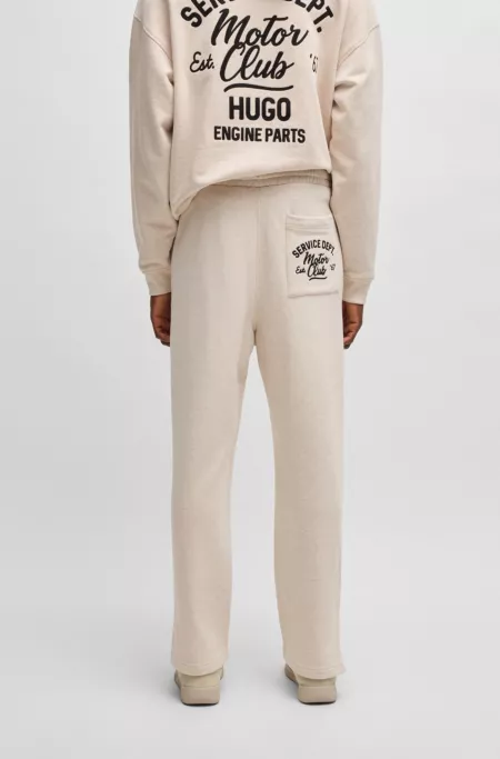 Cotton-terry tracksuit bottoms with embroidered graphics