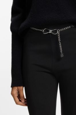 Flared trousers with front slits and chain belt, Black