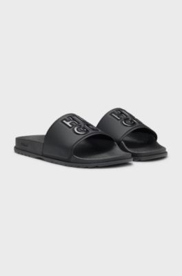 Rubber slides with debossed stacked logo, Black
