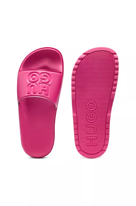 Rubber slides with debossed stacked logo